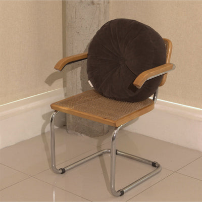 Brown cotton corduroy round cushion on chair - handmade in UK
