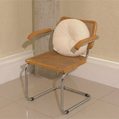 Cream cotton corduroy round cushion on chair - handmade in UK