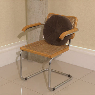 Brown cotton corduroy round cushion on chair - handmade in UK