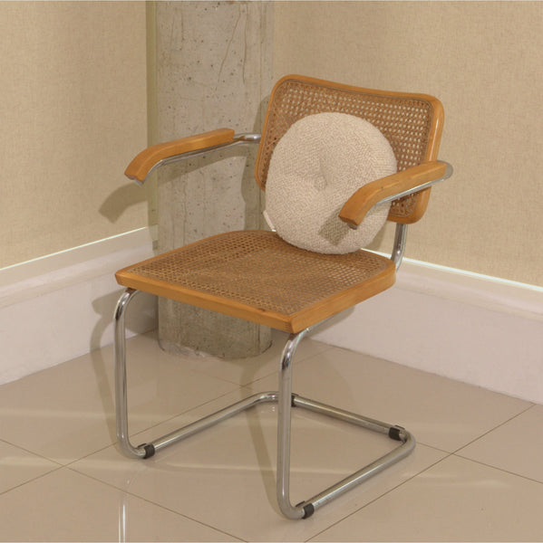 Cream wool bouclé round cushion  on chair - handmade in UK
