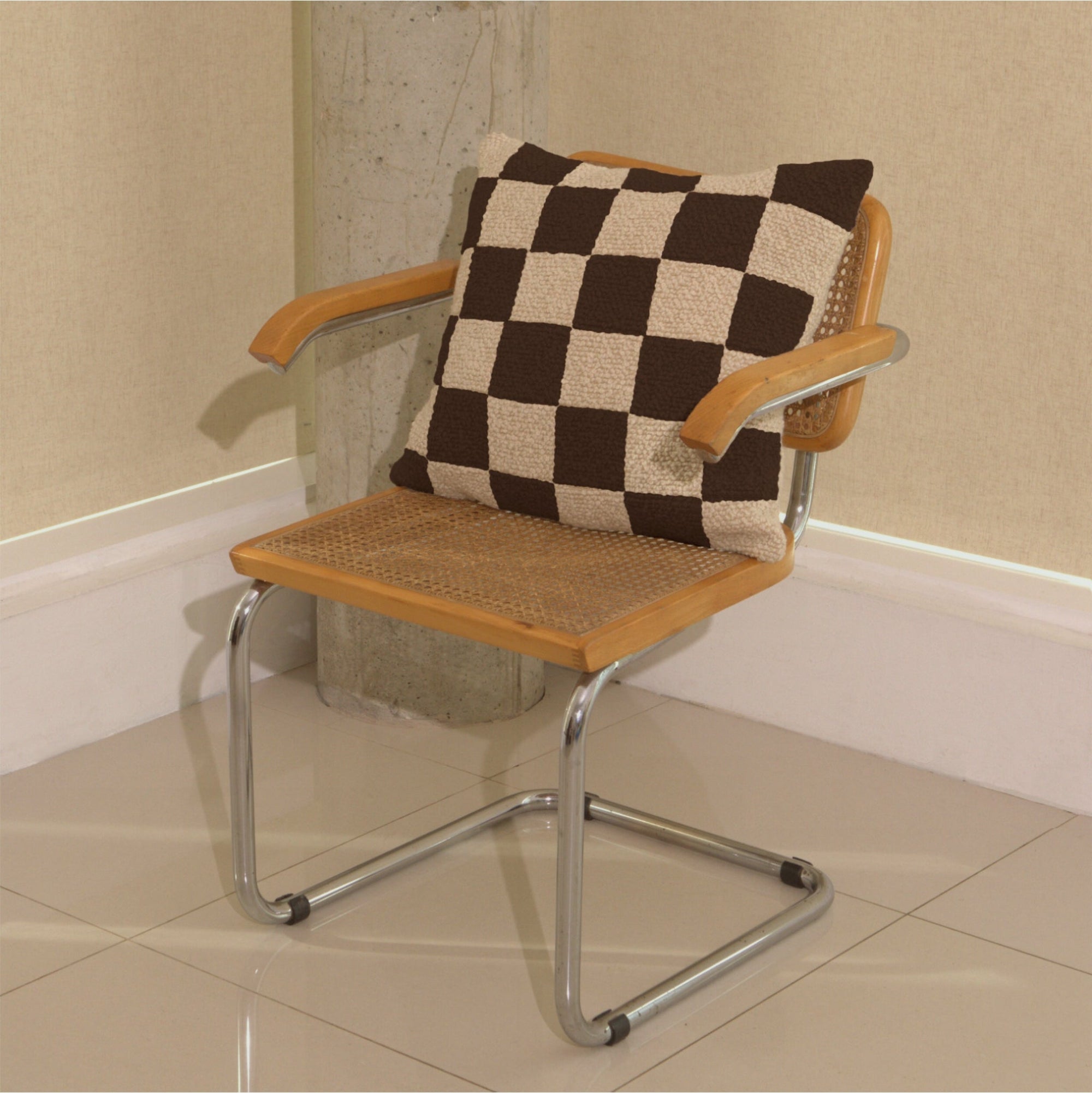 Cream and brown wool bouclé checkered square cushion on chair - handmade in UK