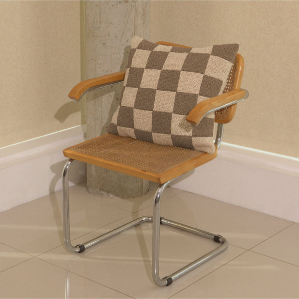 Cream and beige wool bouclé checkered square cushion on chair - handmade in UK