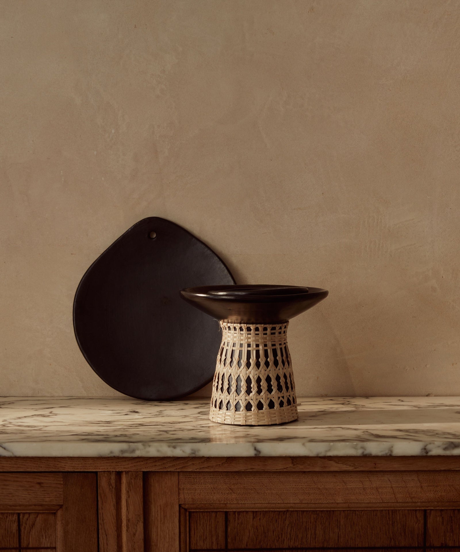 Chamba Comal grill pan lifestyle — Colombian black clay cookware on hob