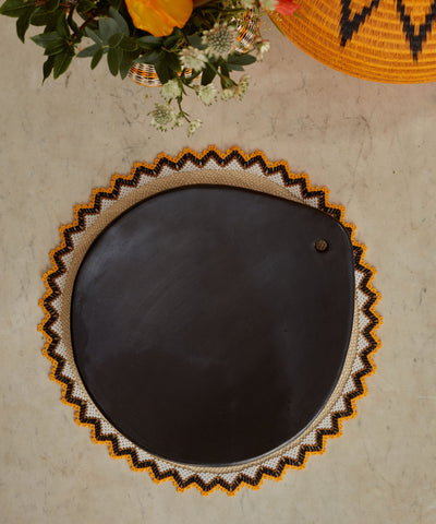 Chamba Grill Pan detail — hand-polished natural black clay surface