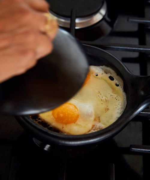 Chamba Sauté Pan with food — handmade Colombian black clay cookware