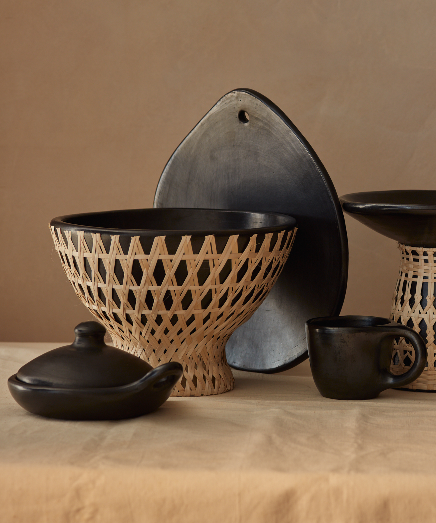 Selva bowl - sculptural fruit bowl in black clay and palm fibre