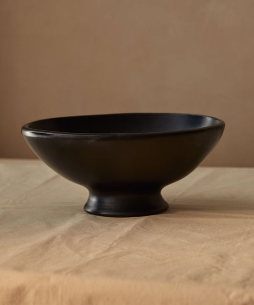 Chamba Oval Fruit Bowl lifestyle — handmade Colombian black clay serveware