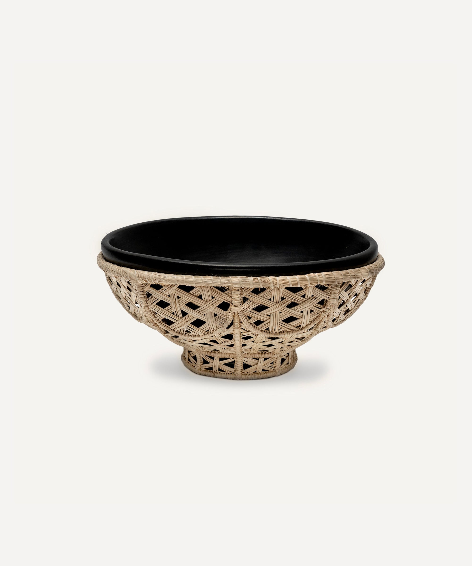 Amaranta Oval Bowl - Chamba black-clay bowl set in a handwoven Iraca palm nest, Colombia