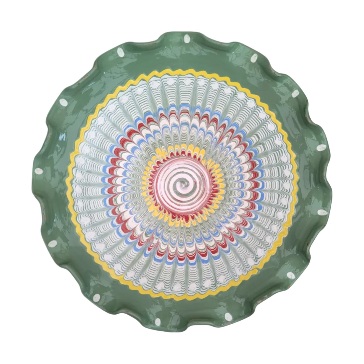 Decorative plate with a colorful spiral design on a green rim against a white background
