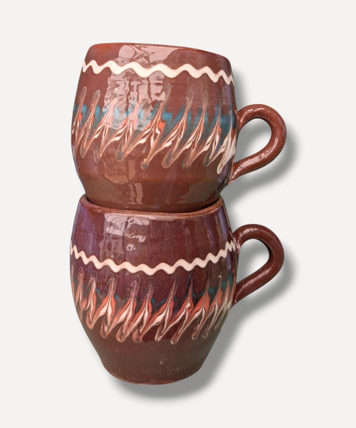 Dark chocolate brown handmade ceramic mug with traditional Romanian folk decoration