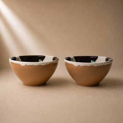 Two ceramic bowls with a brown base and white rim on a beige  background -lifestyle