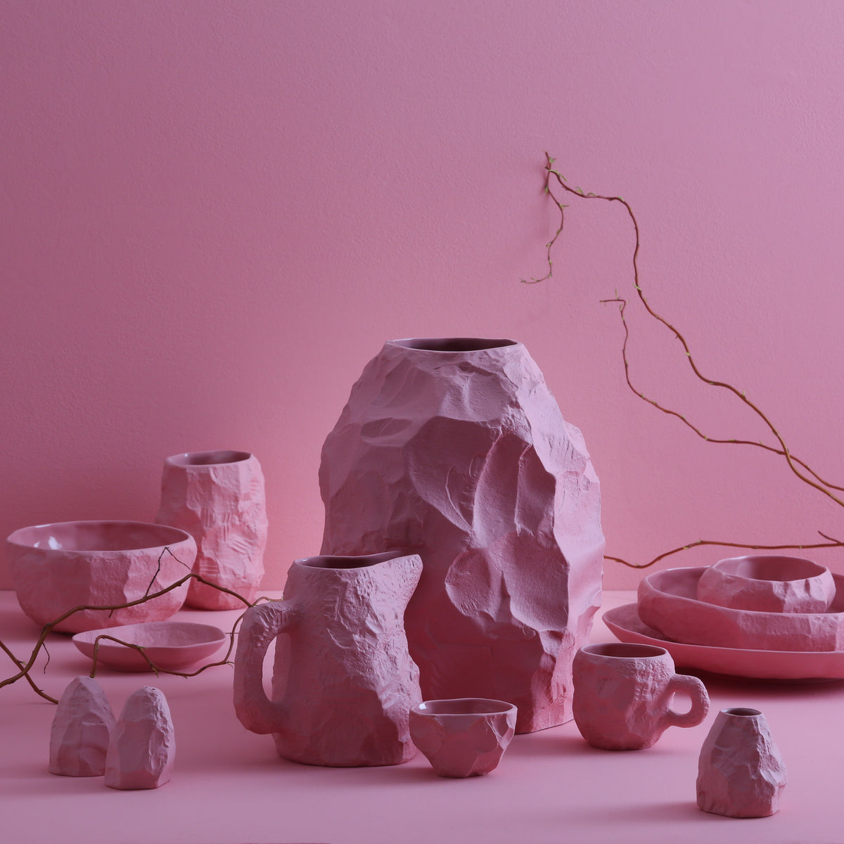 The Crockery Pink Big Vase 2 is crafted by Max Lamb in his studio, chipped with the tools of a stone mason to craft the piece