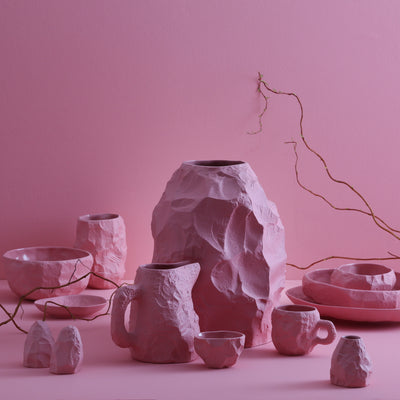 The Crockery Pink Big Vase 2 is crafted by Max Lamb in his studio, chipped with the tools of a stone mason to craft the piece