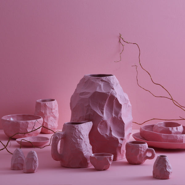 The Crockery Pink Big Vase 2 is crafted by Max Lamb in his studio, chipped with the tools of a stone mason to craft the piece
