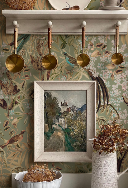 Framed painting of art in kitchen cabinet with botanical green 'Deus ex Gardenia's' Resplendent Woods Wallpaper in Willow. Photo by The Introverts Home.