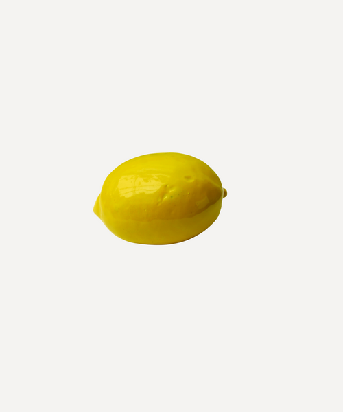 Handmade ceramic lemon with glossy glaze by Marla Primrose – realistic artisan stoneware fruit decor handcrafted in the UK.