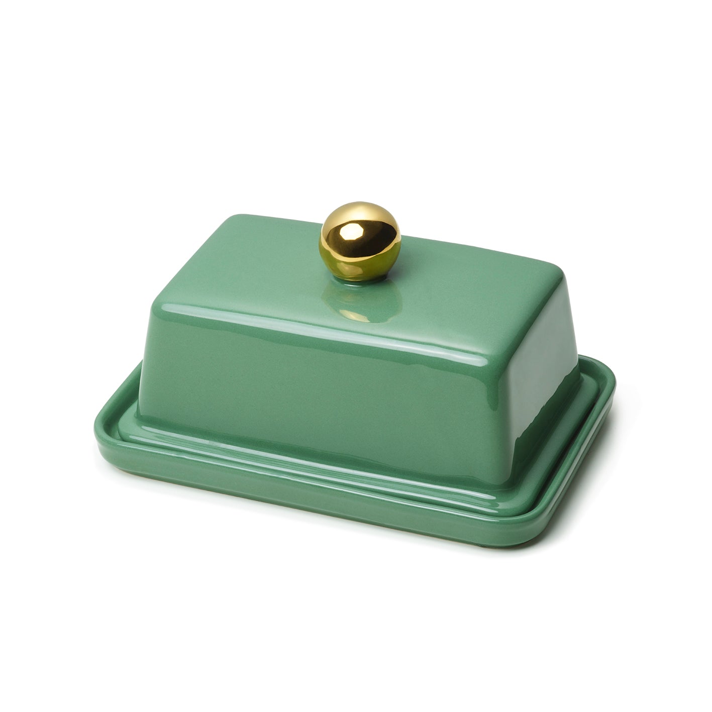 A green ceramic butter dish with a gold-colored knob on the lid.
