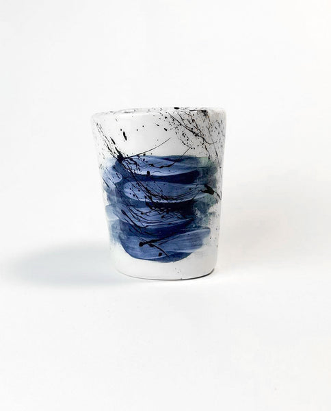 Ceramic mug with Greek flag abstract design on a white background