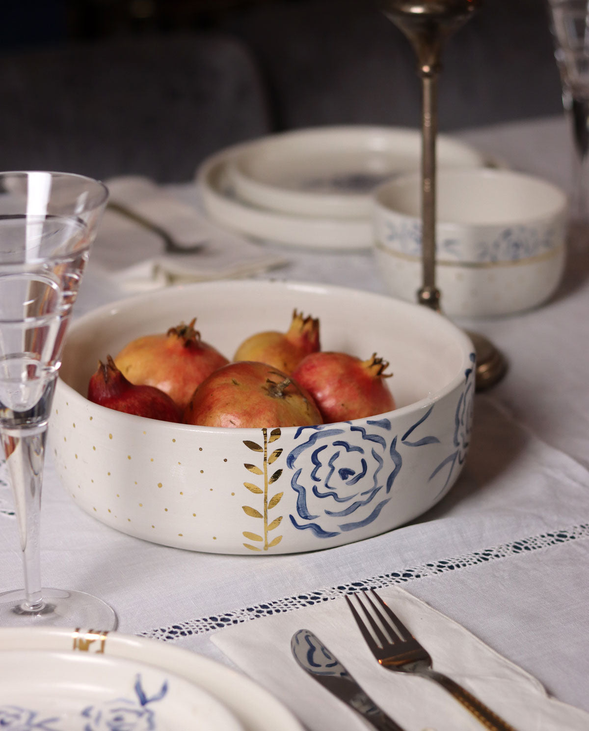HANDPAINTED LUXURY CERAMIC BOWL WITH BLUE FLOWERS AND GOLD DETAILS ON A SPECIAL OCCASION TABLE SETTING