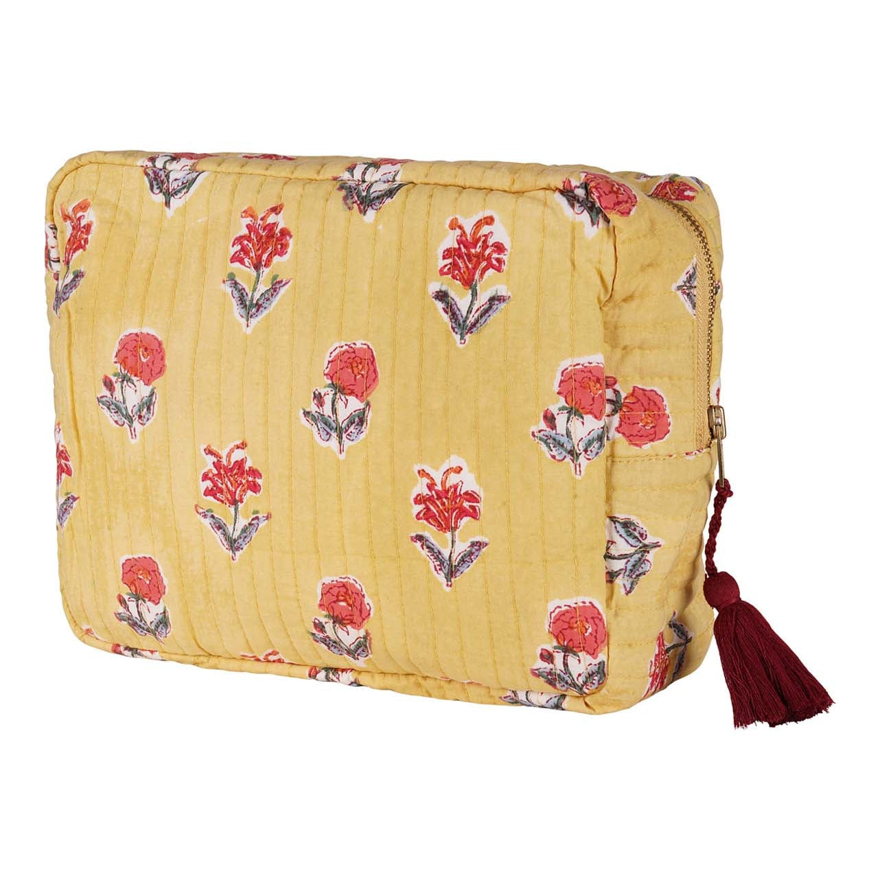 A yellow cotton vanity pouch with red floral hand block printing and a dark red tassel.