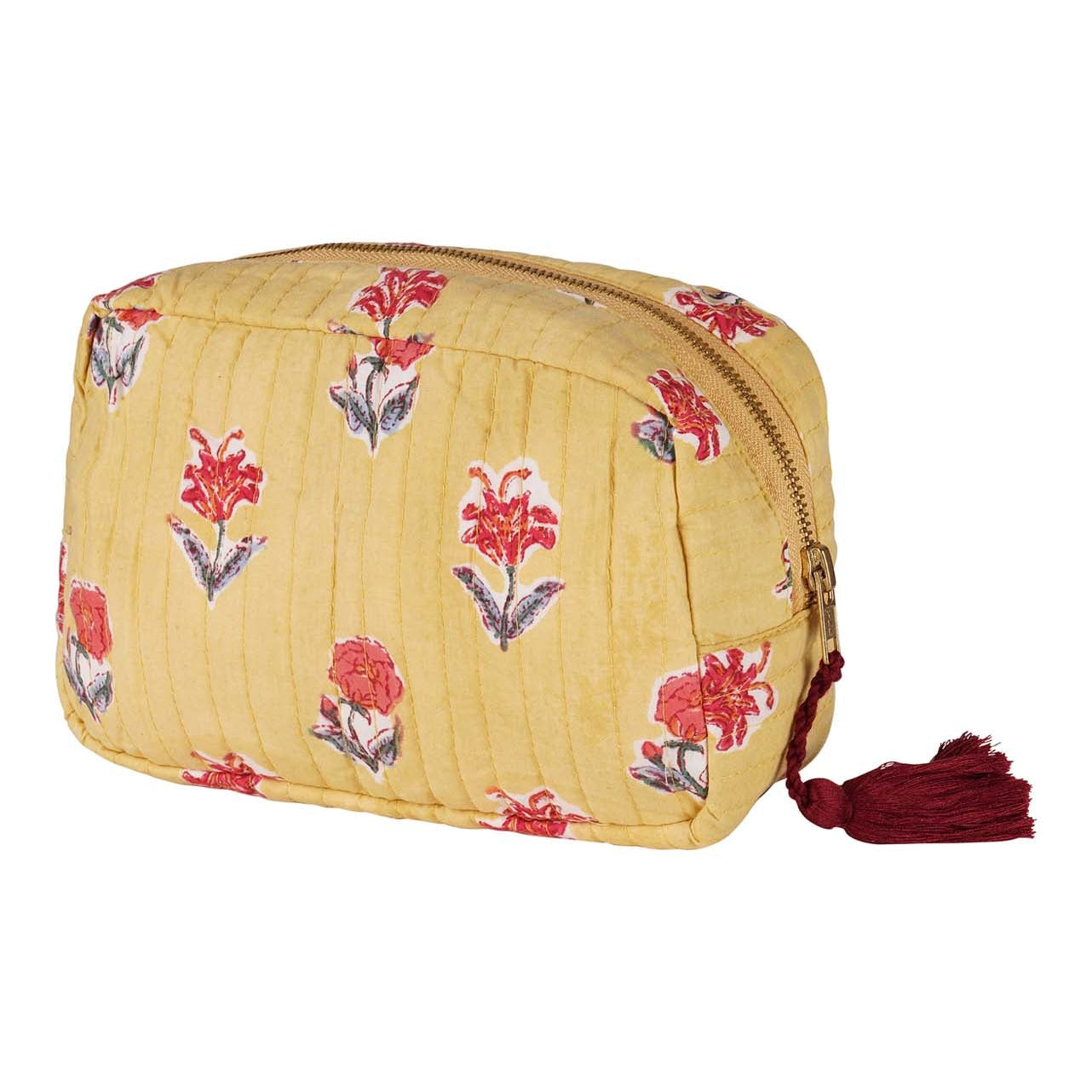 A yellow cotton vanity pouch with red floral hand block printing and a dark red tassel.