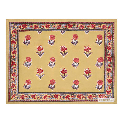 A hand-block printed yellow cotton table mat with red floral patterns and blue border.