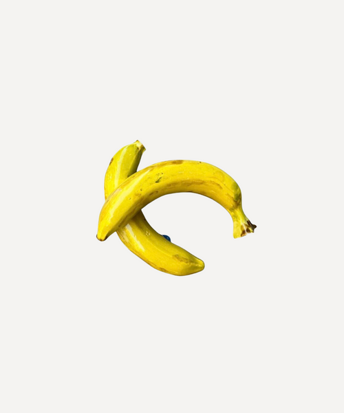 Glossy handmade ceramic banana, crafted in Spain from stoneware – a bold and cheerful artisan accent for your home.
