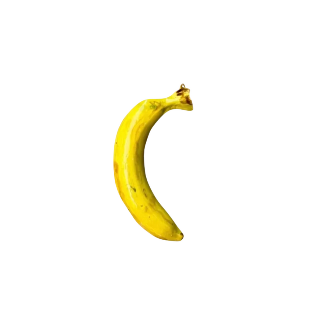 Glossy handmade ceramic banana, crafted in Spain from stoneware – a bold and cheerful artisan accent for your home.