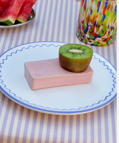 Handmade rectangular stoneware egg cup in a pink finish. Artisanal design with a minimalist aesthetic, perfect for serving soft-boiled eggs. Unique handcrafted texture and earthy tone, ideal for rustic or modern kitchen décor.
