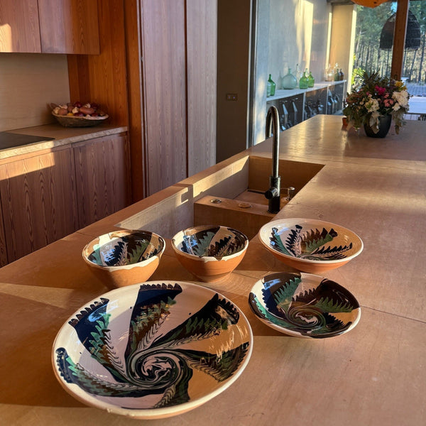 Decorative bowls on a wooden kitchen counter with a modern kitchen background -lifestyle
