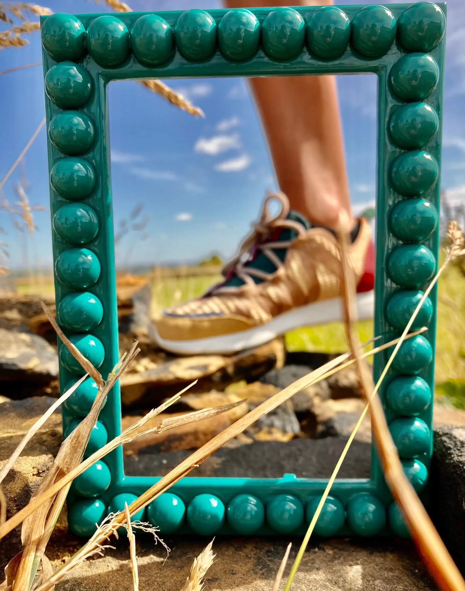 Teal Bobbin Frame outdoors 