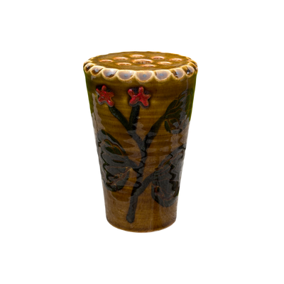 Ceramic cup with floral design on a white background