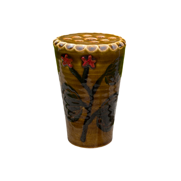 Ceramic cup with floral design on a white background