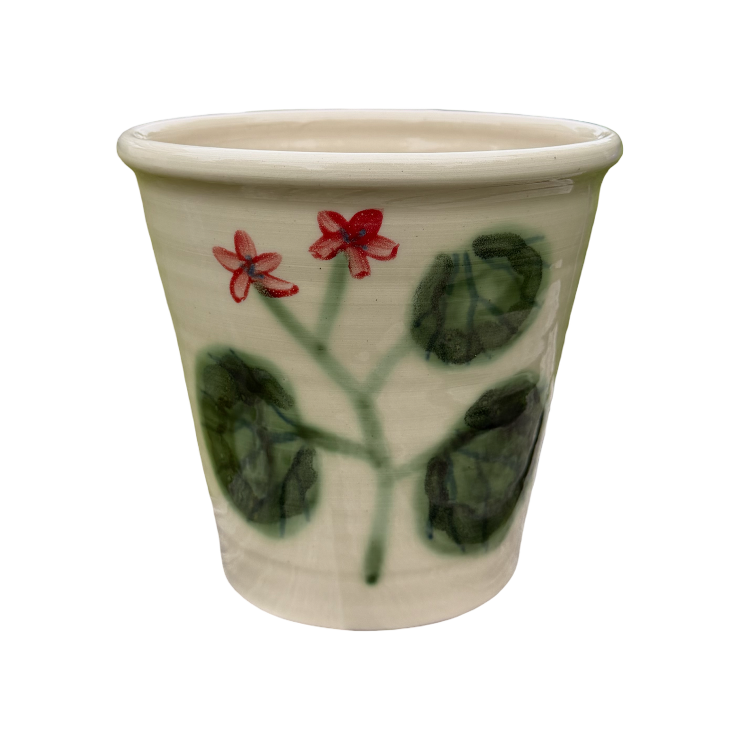 Ceramic pot with floral design on a white background
