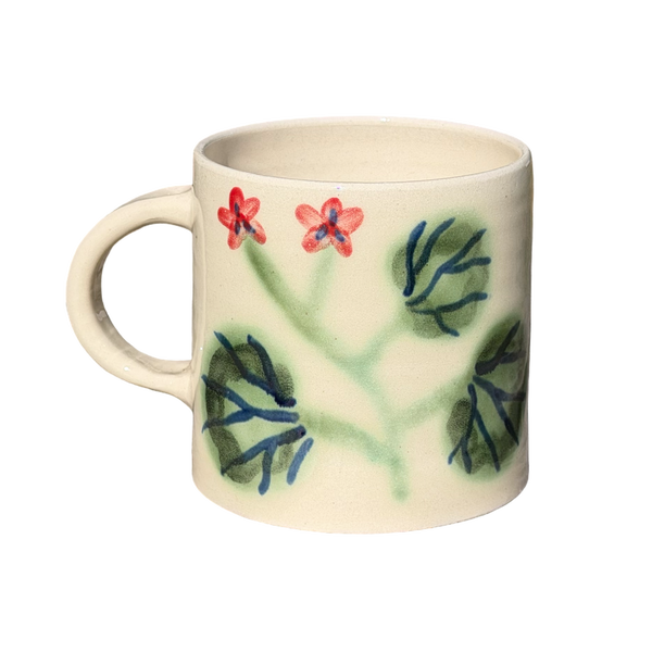 Ceramic mug with floral design on a white background