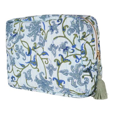 A medium-sized hand block-printed vanity pouch with floral patterns, displayed in an upright position with the zipper closed. The pouch is made of cotton and has a soft, solid color background with detailed prints.