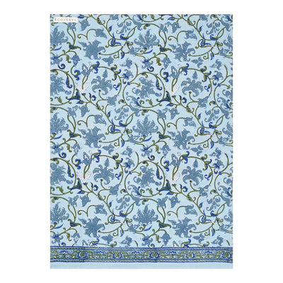 A hand-block printed cotton tea towel with a floral pattern in blue and green hues.