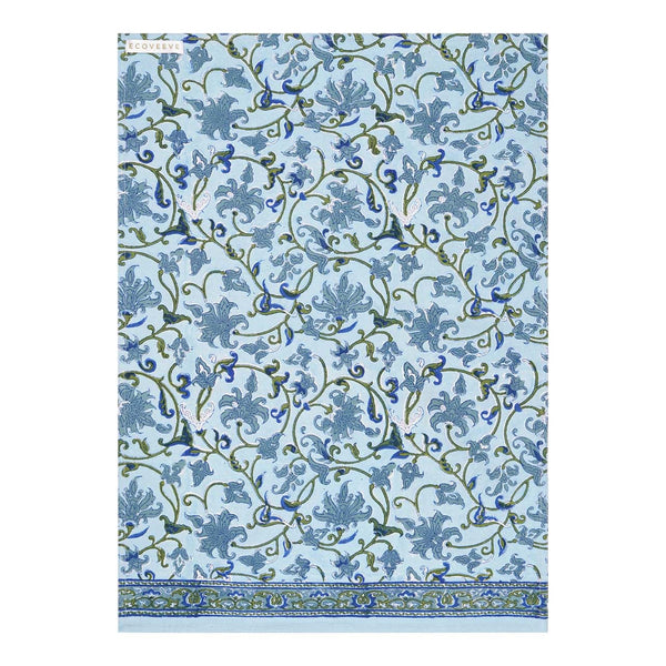 A hand-block printed cotton tea towel with a floral pattern in blue and green hues.
