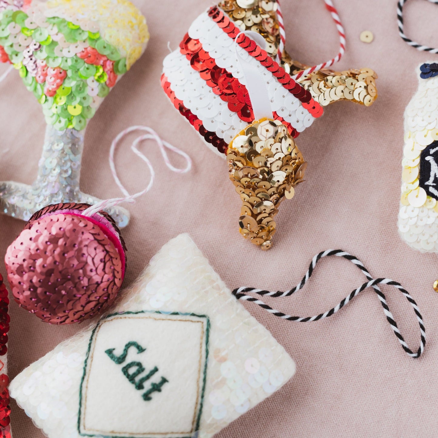 A selection of ornaments including salt, fried chicken, macaron, shrimp cocktail