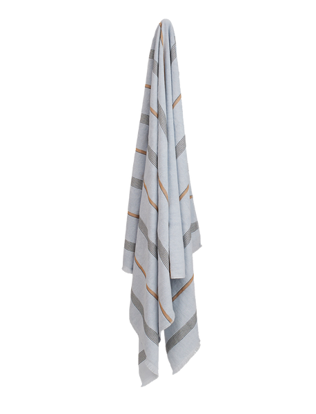 Pale blue towel with black and tan stripes hanging on a wall. 