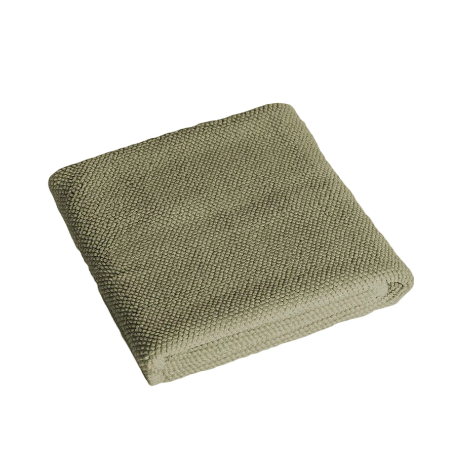 Købn Olive Bathmat folded with a plush pile chunky cotton weave