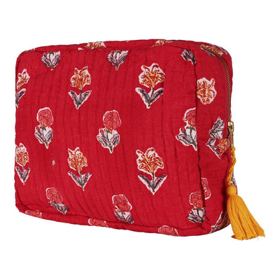 A red hand block-printed vanity pouch with floral patterns, crafted from cotton, with a yellow tassel on the zip.