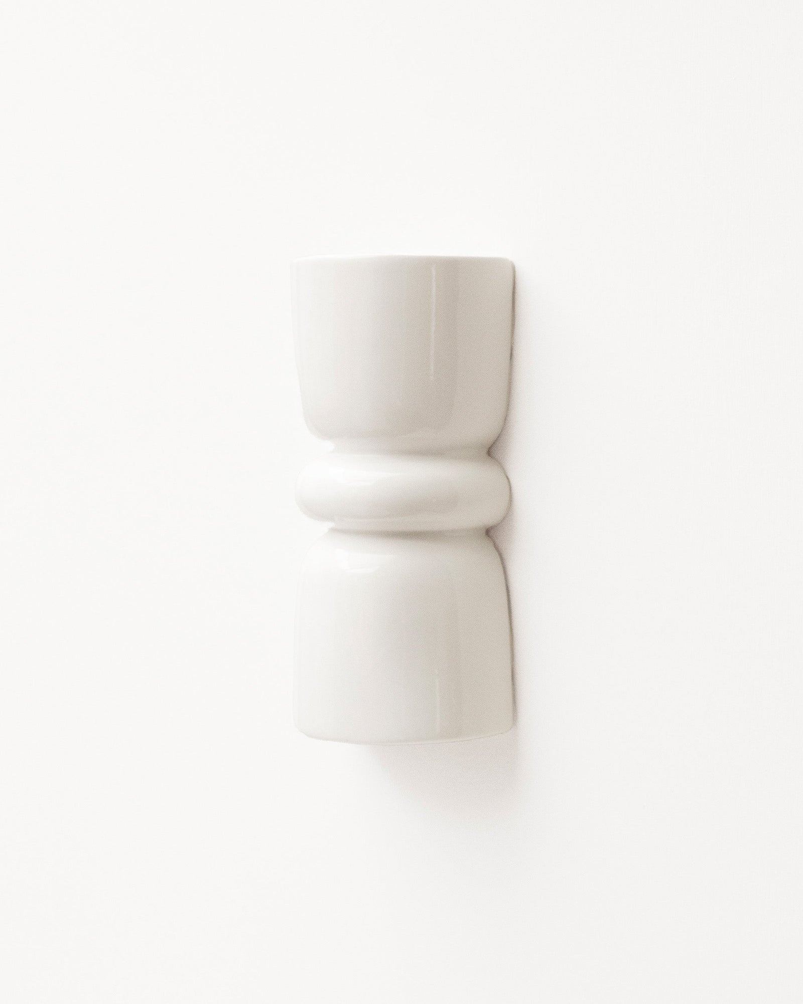 Late Afternoon Lighting White Up and Down lighter Ceramic Wall Light on a white wall