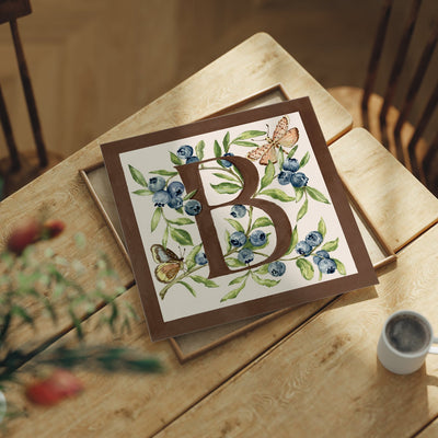 Letter B botanical alphabet art print featuring hand-painted blueberry and butterflies  in chocolate brown and soft pink. 