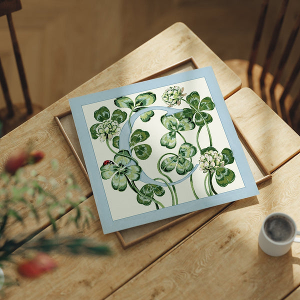Letter C botanical alphabet art print featuring hand-painted clover leaves in blue and green.