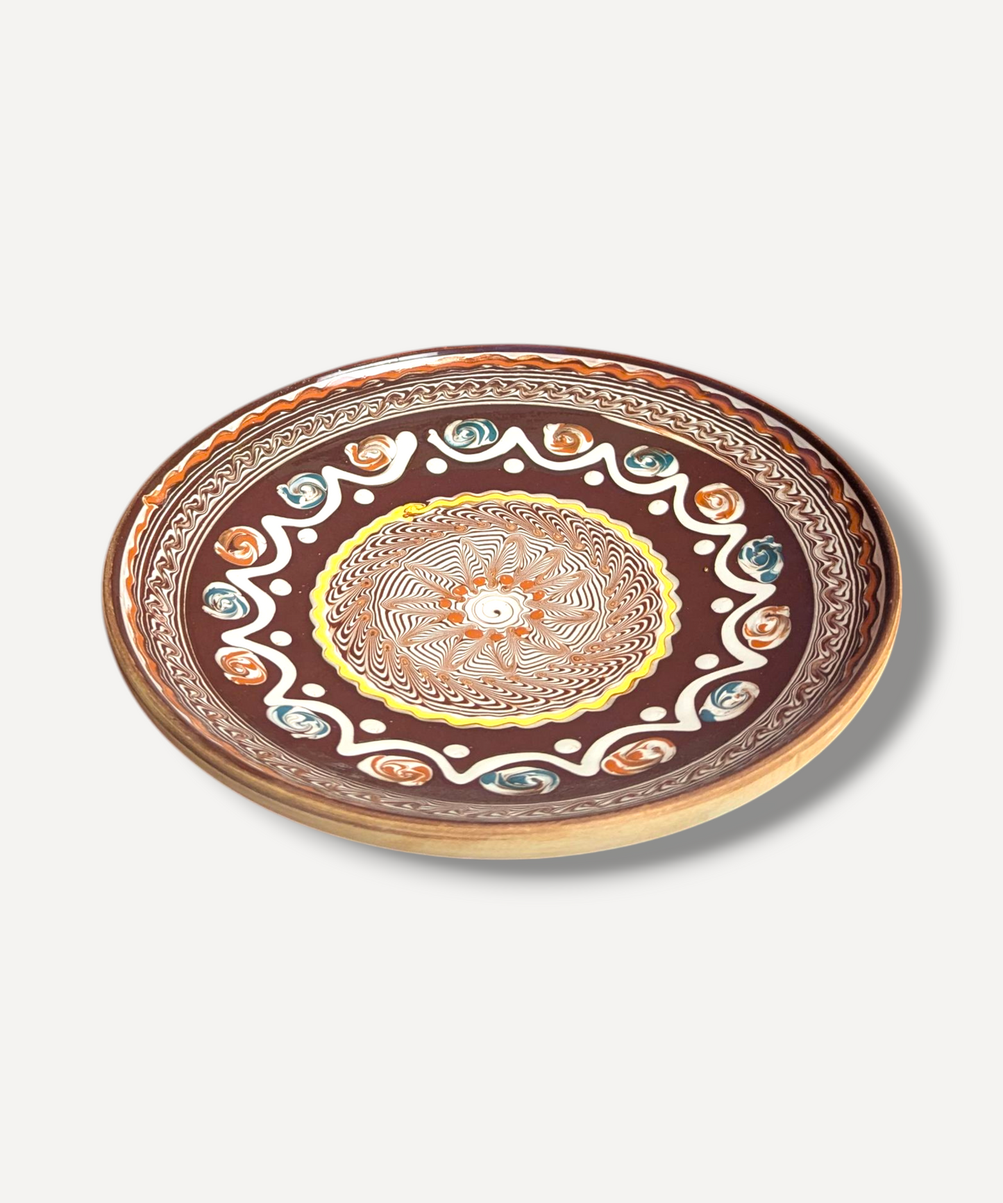 Decorative plate with a colorful mandala design on a white background