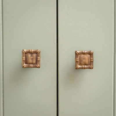 Linley-bamboo-brass-knobs-on-cabinet