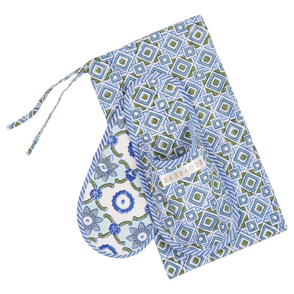 A pair of hand block-printed cotton slippers with a geometric pattern in blue and white colors, displayed alongside a matching carry pouch.