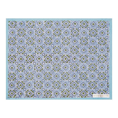 A hand-block printed blue cotton table mat with a geometric pattern.