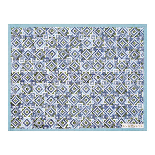 A hand-block printed blue cotton table mat with a geometric pattern.